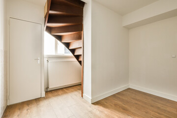 a bedroom with a staircase and a door leading to