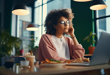 Young ethic woman enjoys eating tasty lunch