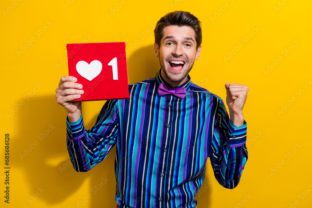 Poster photo of satisfied ecstatic funny man with stubble dressed striped shirt get one more like on post i