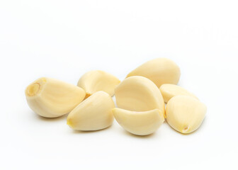 Peeled cloves of white garlic with a clipping path. White background, isolated. Full depth of field.