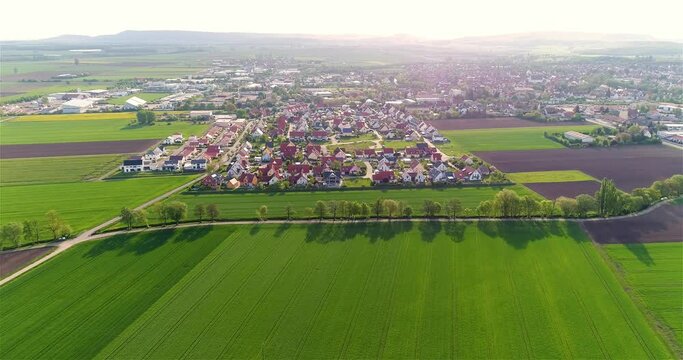 Green fields around a small town. Beautiful European landscape. Small European city aerial view. german village aerial view. european landscape