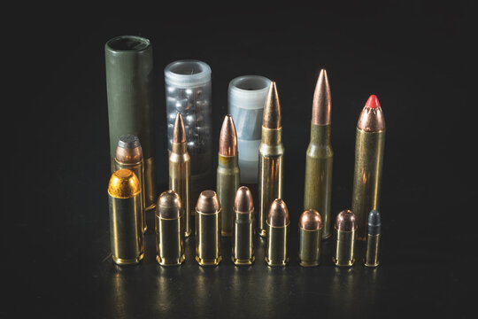 Various weapon cartridges from the weakest 22lr to the most powerful 50AE, shotgun, revolverand rifle ammunition.Close-up photo.