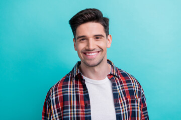 Photo of positive good mood guy wear checkered shirt smiling showing white teeth isolated blue teal color background