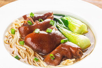 A bowl of pork knuckle noodles
