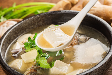 Chinese cuisine: crucian carp tofu soup - obrazy, fototapety, plakaty