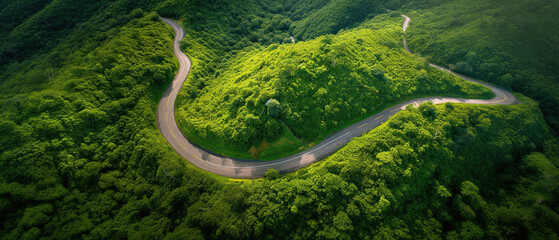 Aerial view of a winding mountain road with lush greenery, made with Generative AI