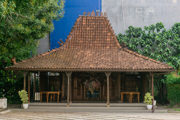Omah Limasan or Traditional javanese joglo house or rumah joglo roof with ornament. Joglo which consists of 4 main pillars. 