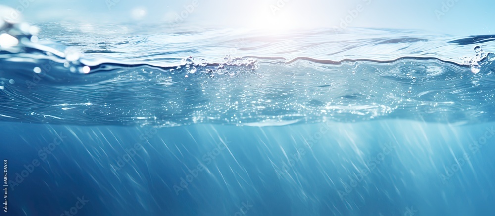 Poster Abstract nature background with calm clear and bubbly blue water waves in sunlight Copy space image Place for adding text or design