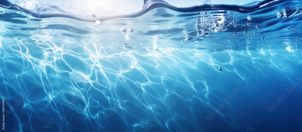 Leinwandbilder abstract nature background with calm clear and bubbly blue water waves in sunlight copy space image 