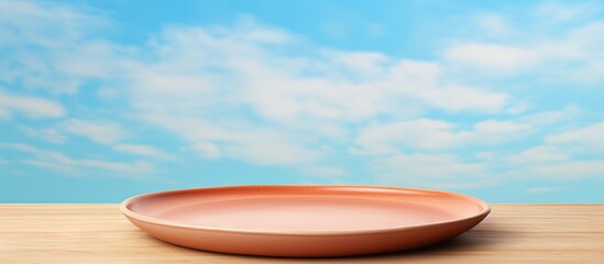 Artistic handmade ceramic plate on a sky themed clay tray Copy space image Place for adding text or design