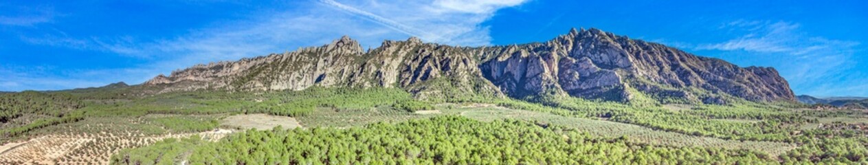 Drone panorama of the mountain range near the Monserrat monastery near Barcelona during the day