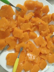 cooked pumpkin pieces in a dish