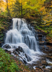 Fototapeta na wymiar Autumn waterfall at Ricketts Glen State Park - Pennsylvania - Erie Falls