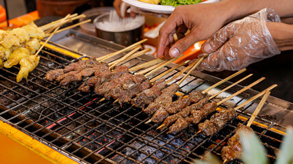 Jando Bandung meat satay is being grilled, sate jando bandung