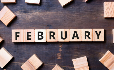 February spelled out on wooden blocks.