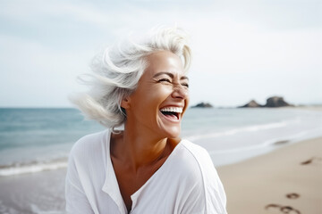 Fototapeta na wymiar a happy woman with white hair on a beach, leaving footprints in the sand, with the ocean in the background, ai generative