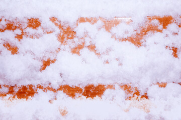 Winter natural background. Snow on wood.