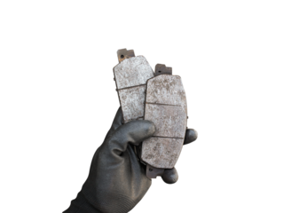 Used car brake pads in the hands of a mechanic isolated  , Car spare parts and maintenance concept