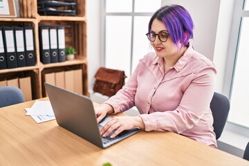 Young beautiful plus size woman business worker using laptop working at office