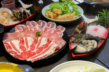 Delicious hotpot with fresh beef and vegetable in restaurant