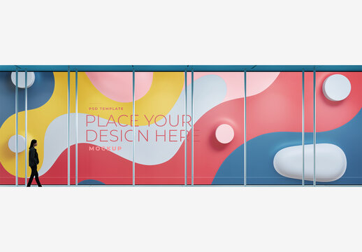 Gallery Frame Mockup: Man Walking in Front of Blue Wall with Lights & Clock Tower in Background Gallery Frame Mockup Template