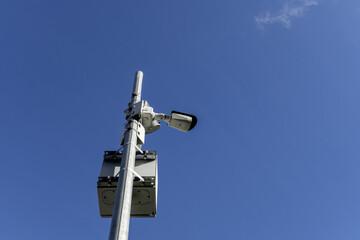 A pole with surveillance cameras with electrical energy accumulators