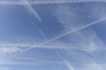 Sky landscape with traces of aircraft with contrails. Vector sky texture background