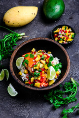 Grilled salmon with mango salsa and rice.top veiw