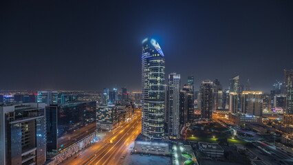 Panorama showing Dubai Downtown and business bay night timelapse with tallest skyscraper and other...