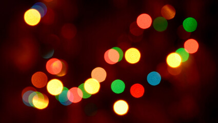 Abstract shiny colorful blurred bokeh background of Christmas garland lights.Soft focus.
