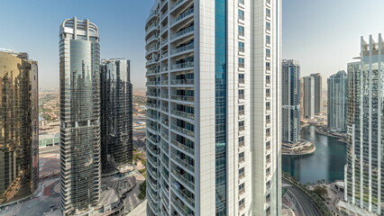 Panorama showing tall residential buildings at JLT aerial timelapse, part of the Dubai multi commodities centre mixed-use district.