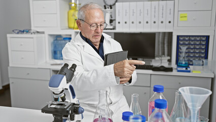 Steely-eyed senior man, a seasoned scientist standing firm in the bustling lab, pointing assertively at a touchpad. amid glowing test tubes and whirring computers, he's immersed in serious research.