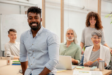 Fototapeta premium African American businessman looking at the camera while standing in office