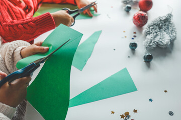 Children cutting out paper, Christmas activity idea