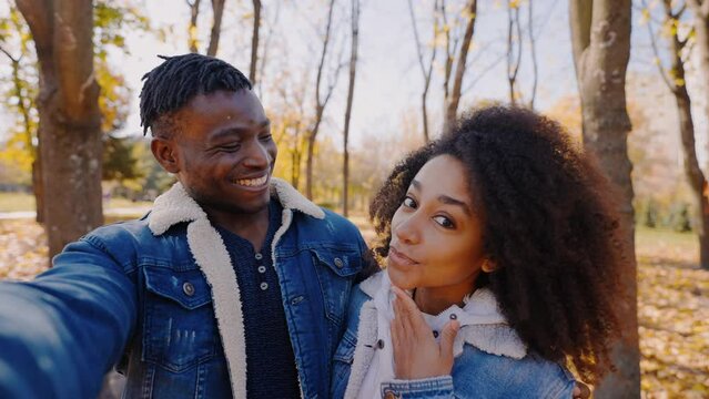 Black girlfriend and boyfriend make selfies to memorize good day