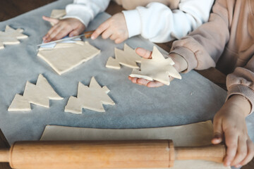 Child making pizza in the shape of a Christmas tree, activity idea