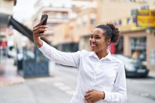 African american woman smiling confident making selfie by the smartphone at street