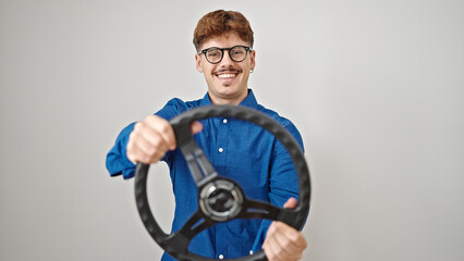 Fototapeta na wymiar Young hispanic man smiling confident using steering wheel as a driver over isolated white background