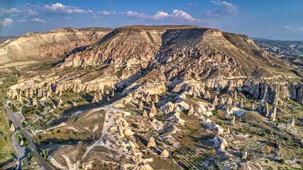 Panoramic view of fairy chimneys in Goreme Historical National Park. Goreme National Park and Rock Sites of Cappadocia, Central Anatolia, Nevsehir Province, Turkey. drone view. Ariel from above, top