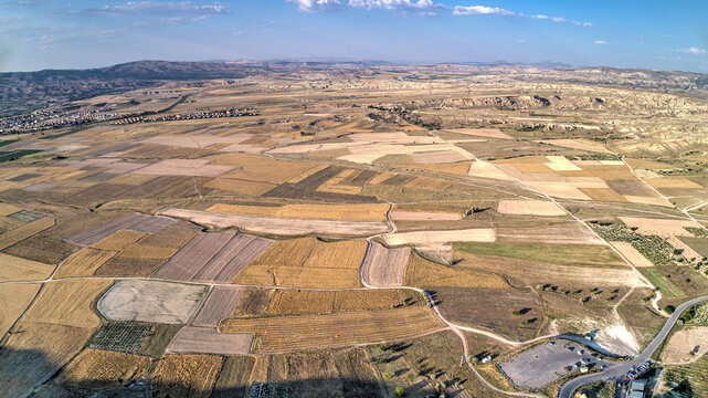 Panoramic view of fairy chimneys in Goreme Historical National Park. Goreme National Park and Rock Sites of Cappadocia, Central Anatolia, Nevsehir Province, Turkey. drone view. Ariel from above, top
