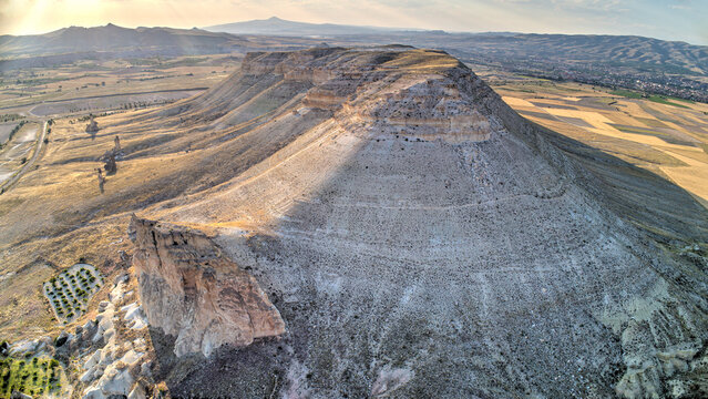 Panoramic view of fairy chimneys in Goreme Historical National Park. Goreme National Park and Rock Sites of Cappadocia, Central Anatolia, Nevsehir Province, Turkey. drone view. Ariel from above, top