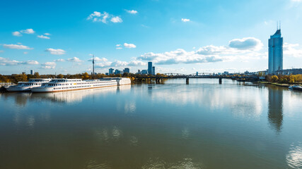 Fototapeta premium Donaustadt is the district of Vienna, Austria. Danube with Bridge, skyscrapers and business centres in Vienna, Austria.
