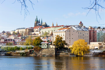 Snowy Prague Lesser Town with Prague Castle above River Vltava in the sunny Day , Czech republic