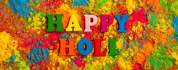 Happy Holi. Colorful background of multicolored gulal powder paints. A colorful festival of colored...