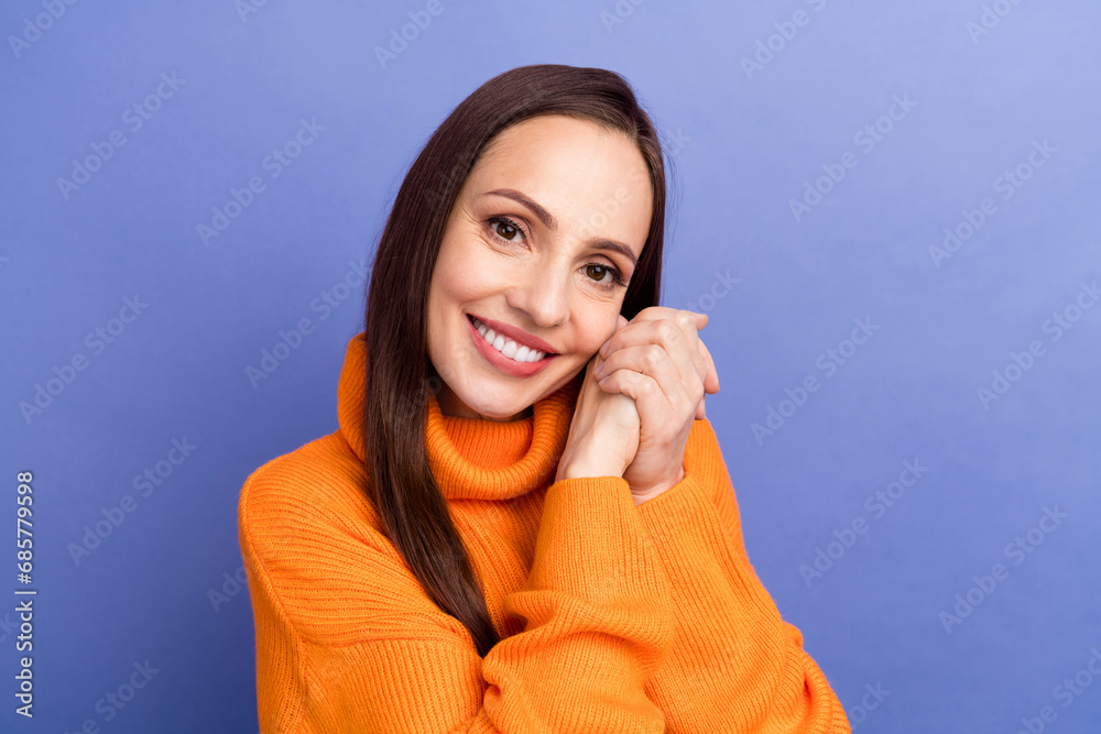 Canvas Prints Portrait of lady in orange sweater clasped hands touch cheek admire dream perfect family idyllic isolated on purple color background