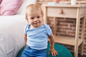 Adorable toddler smiling confident standing at bedroom