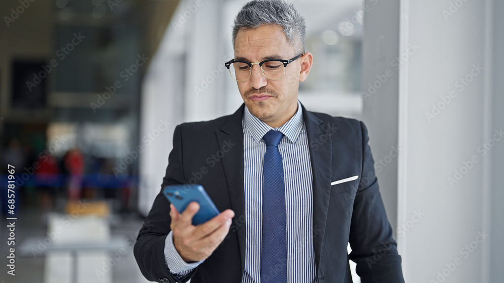 Sticker Young hispanic man business worker using smartphone at office