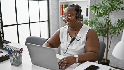 African american woman business worker wearing headset having video call at the office