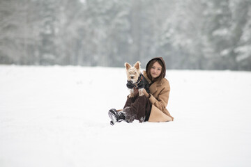 Fototapeta premium Portrait of a young beautiful girl in a winter forest.