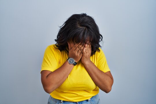 Young Woman Standing Blue Background Sad Expression Covering Face Hands ...